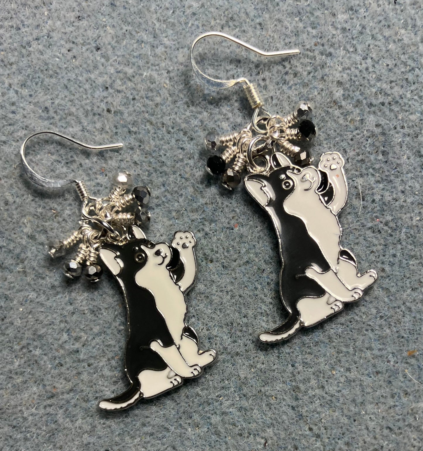 Gray and white enamel husky charm earrings adorned with tiny dangling black, gray, and silver Chinese crystal beads.