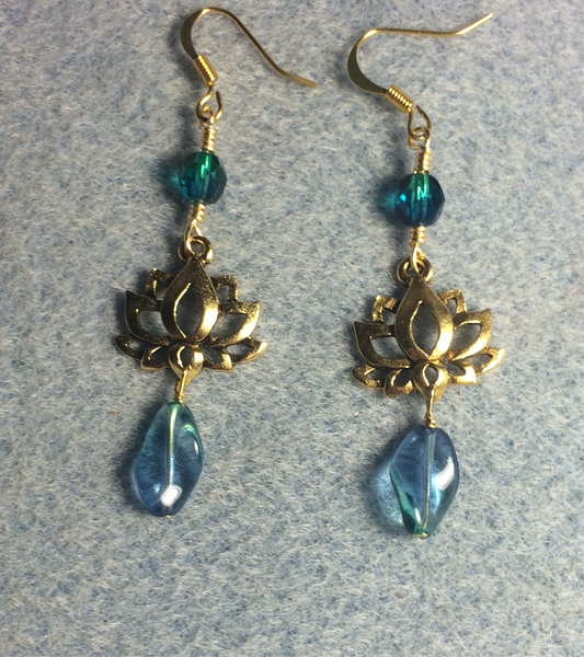 Gold lotus flower connector charm earrings adorned with blue green Czech glass twist beads and blue green Czech glass beads.