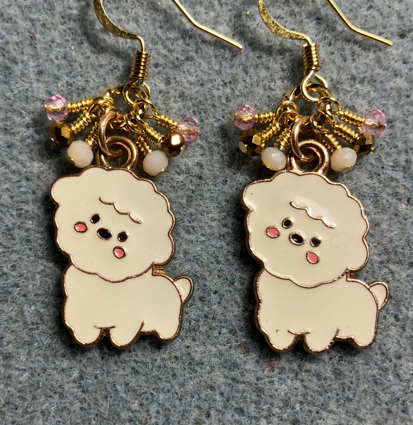 White, pink, and gold enamel puppy dog charm earrings adorned with tiny dangling white, pink, and gold Chinese crystal beads.