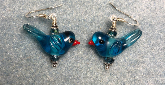 Translucent turquoise lamp work songbird bead earrings adorned with turquoise Chinese crystal beads.