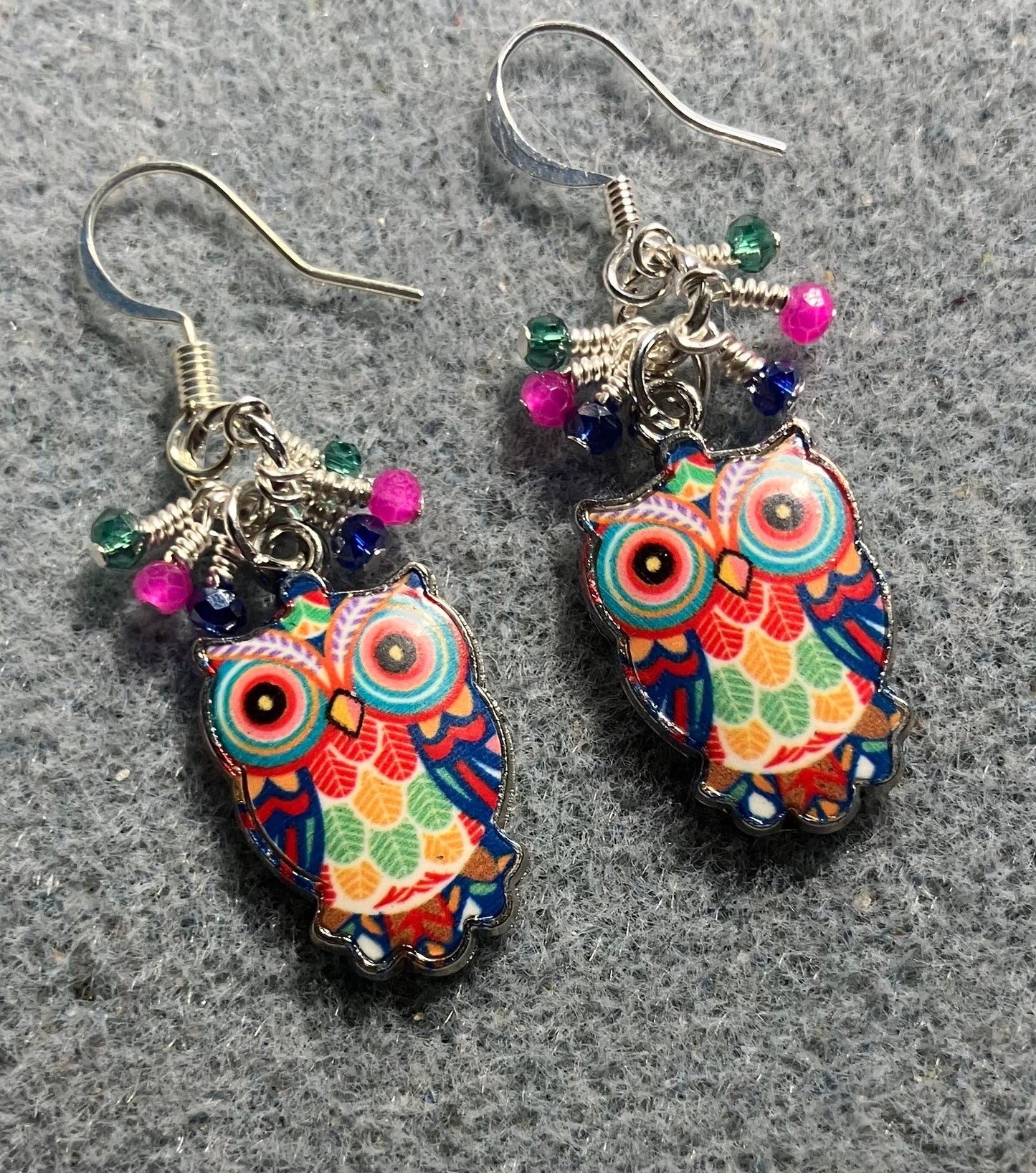 Pink, dark blue, and teal enamel owl charm earrings adorned with tiny dangling pink, dark blue, and teal Chinese crystal beads.