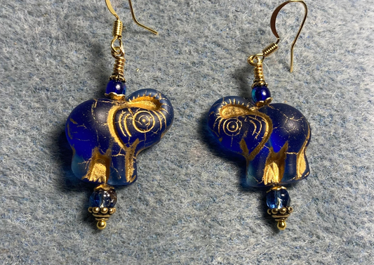 Translucent dark blue (with gold inlay) Czech glass elephant bead earrings adorned with dark blue Czech glass beads.