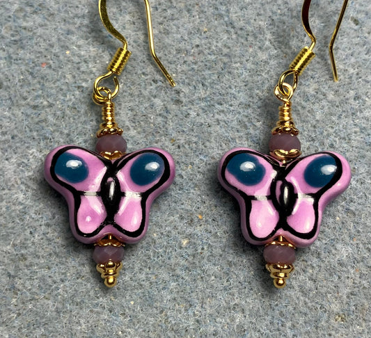 Violet and purple ceramic butterfly bead earrings adorned with violet Chinese crystal beads.