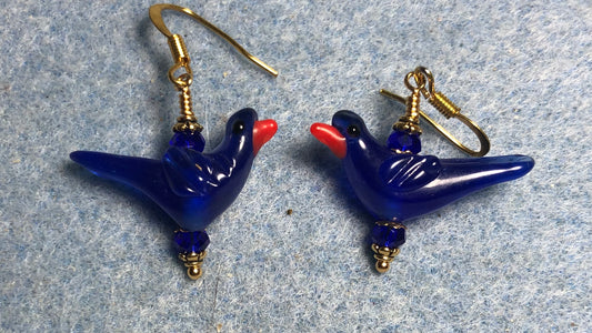 Opaque dark blue lamp work songbird bead earrings adorned with dark blue Chinese crystal beads.