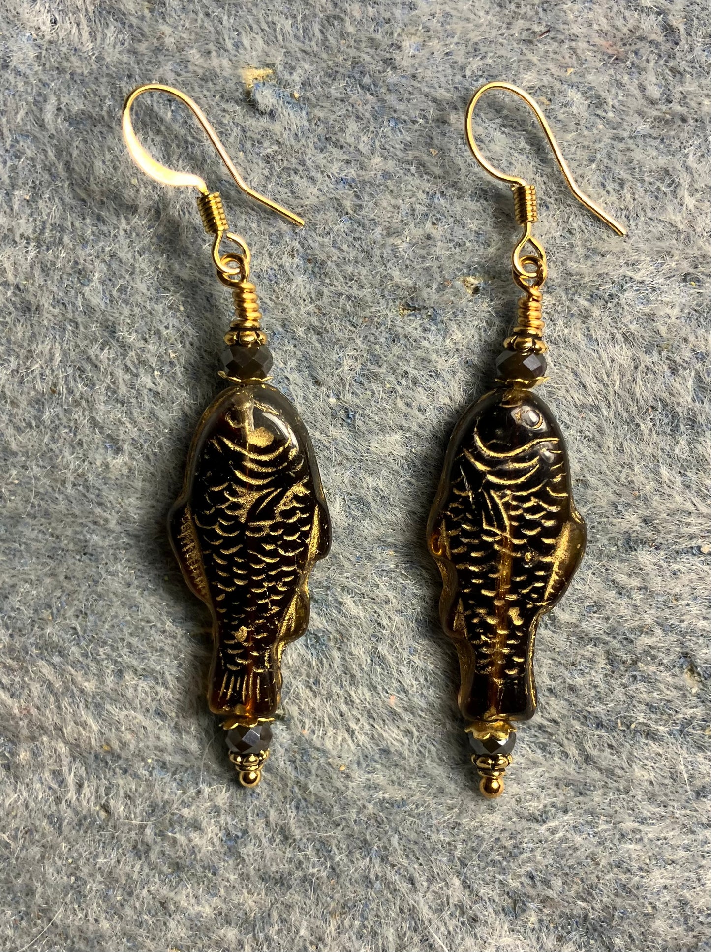 Brown (with gold inlay) Czech glass fish bead earrings adorned with brown Chinese crystal beads.