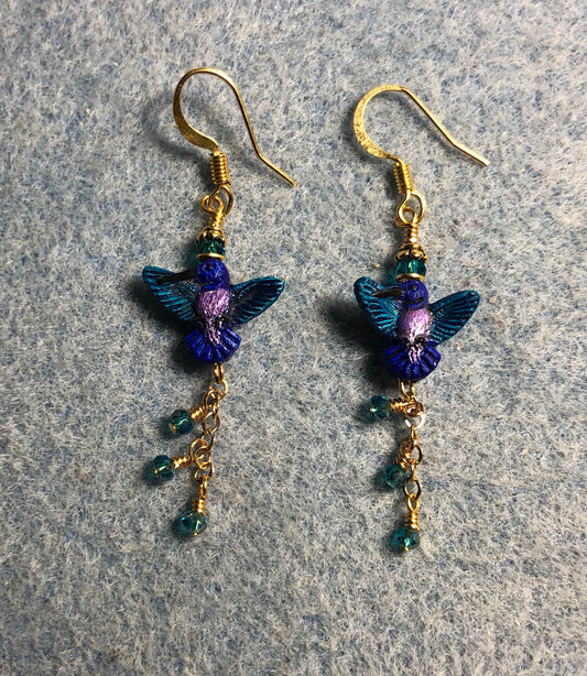 Small turquoise and purple hummingbird bead earrings adorned with gold chain and tiny turquoise Chinese crystal beads.