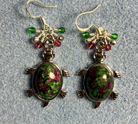 Large silver and red green jasper gemstone turtle charm earrings adorned with small dangling green, silver, and purple Czech glass beads.