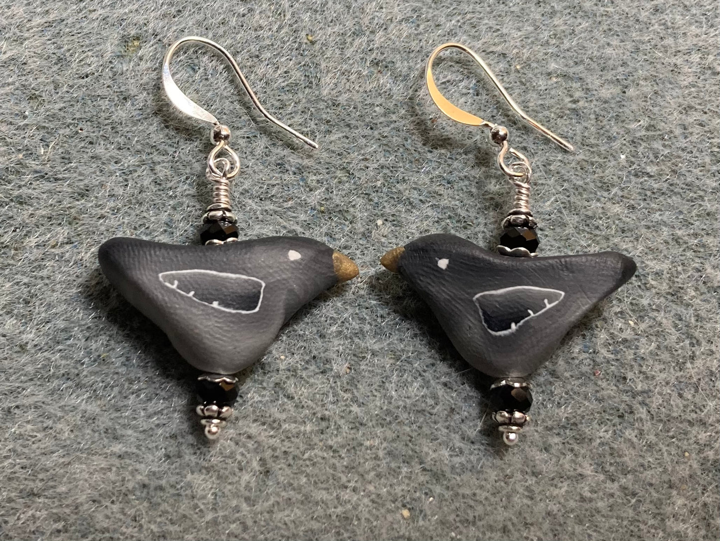 Black polymer clay bird bead earrings adorned with black Chinese crystal beads.