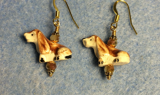 Small tan and brown ceramic puppy dog bead earrings adorned with tan Chinese crystal beads.