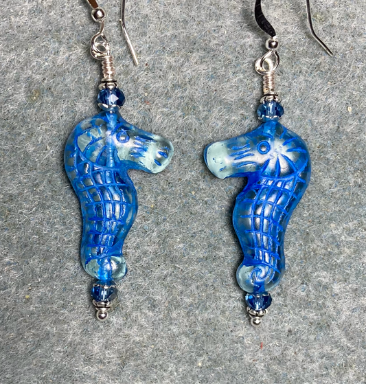 Clear (with blue inlay) Czech glass seahorse bead earrings adorned with blue Chinese crystal beads.
