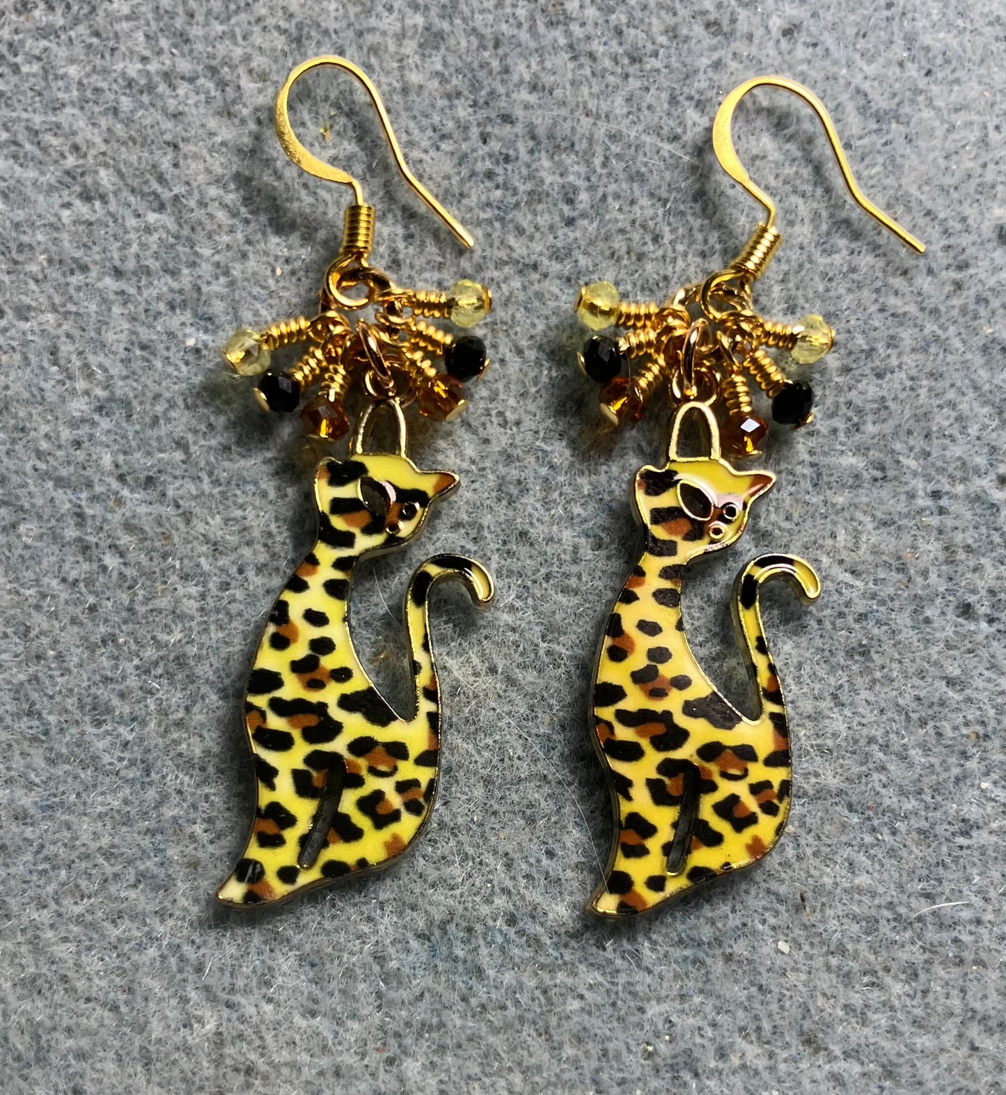 Yellow, black, and topaz enamel spotted cat charm earrings adorned with tiny dangling yellow, black, and topaz Chinese crystal beads.