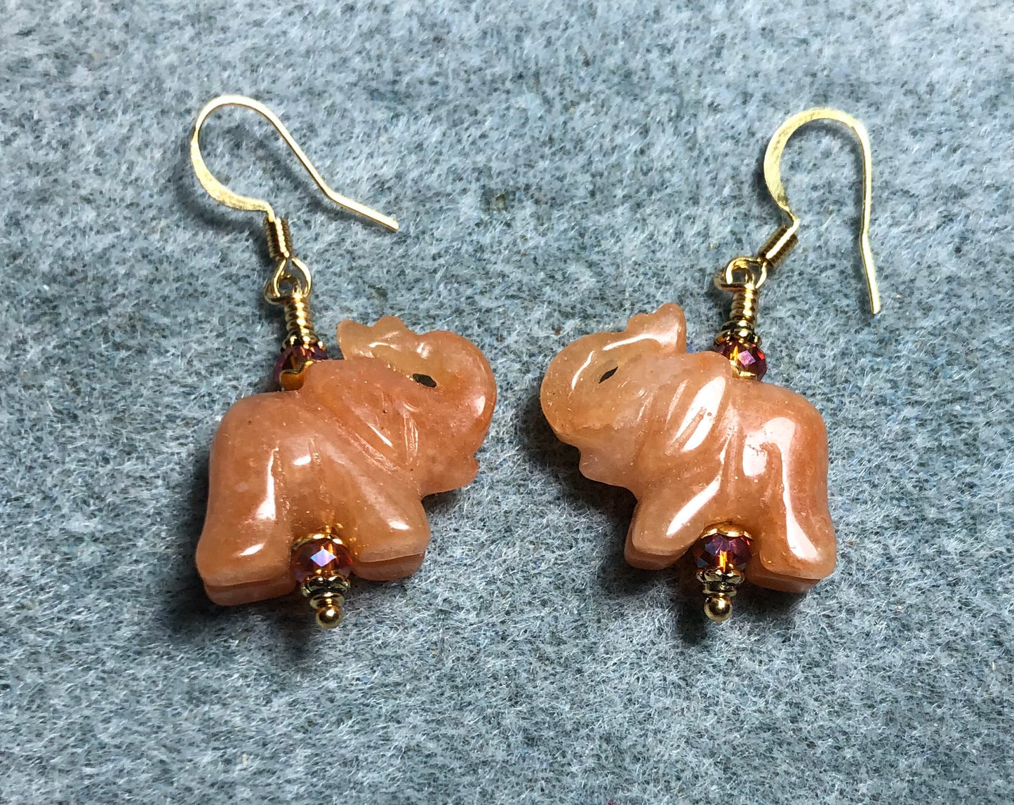 Orange aventurine gemstone elephant bead earrings adorned with orange Chinese crystal beads.