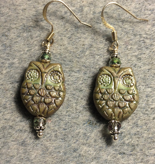 Brownish green Czech glass owl bead earrings adorned with iridescent green Chinese crystal beads.