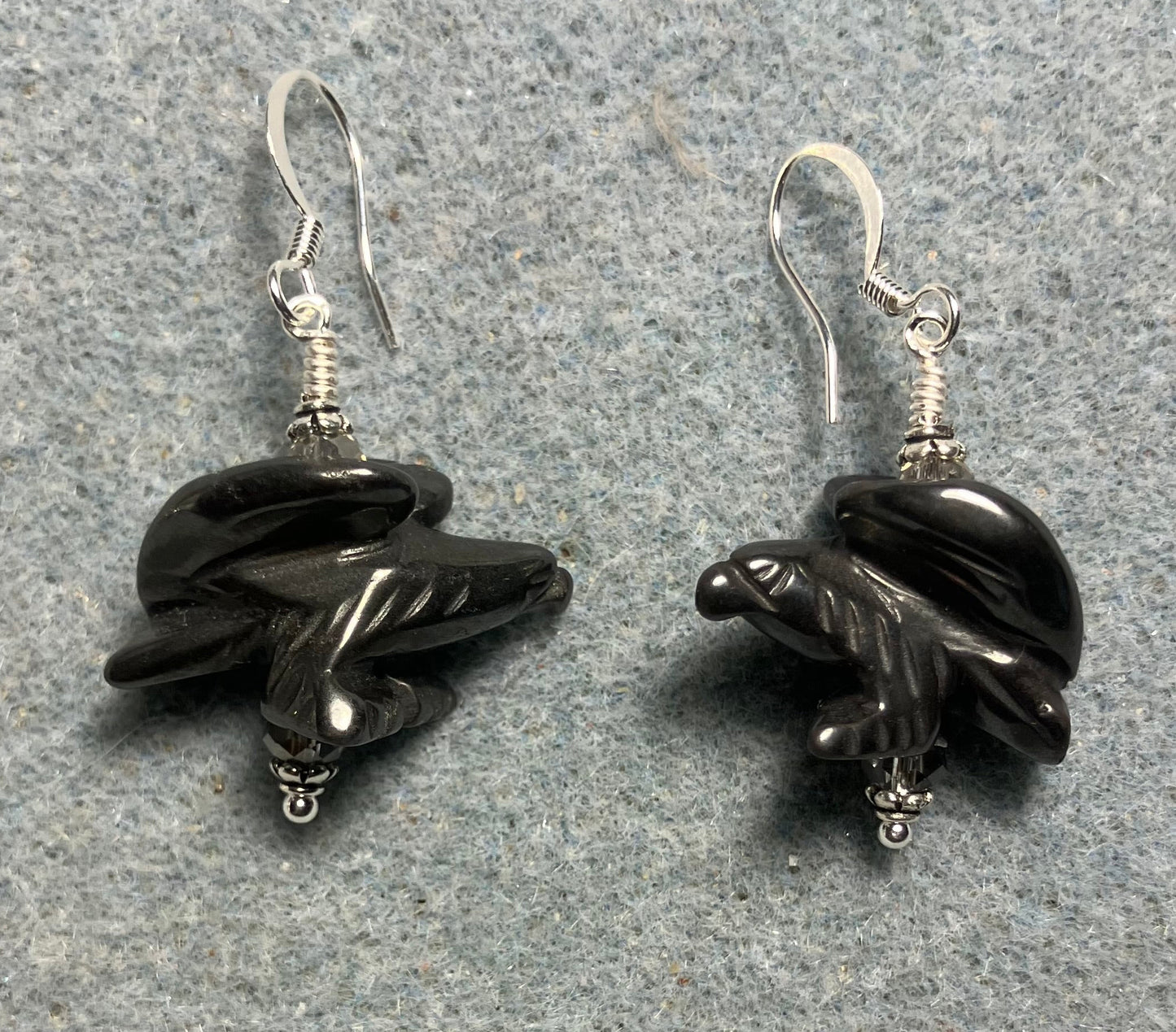 Large gray hematite gemstone flying eagle bead earrings adorned with gray Chinese crystal beads.