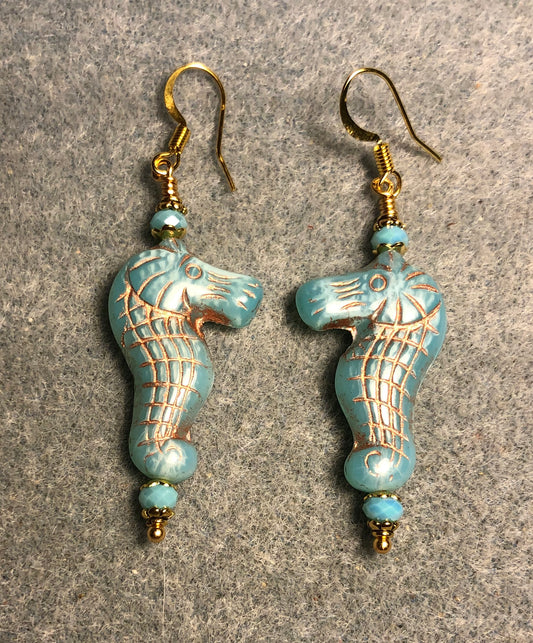 Light aqua (with gold inlay) Czech glass seahorse bead earrings adorned with light aqua Chinese crystal beads.