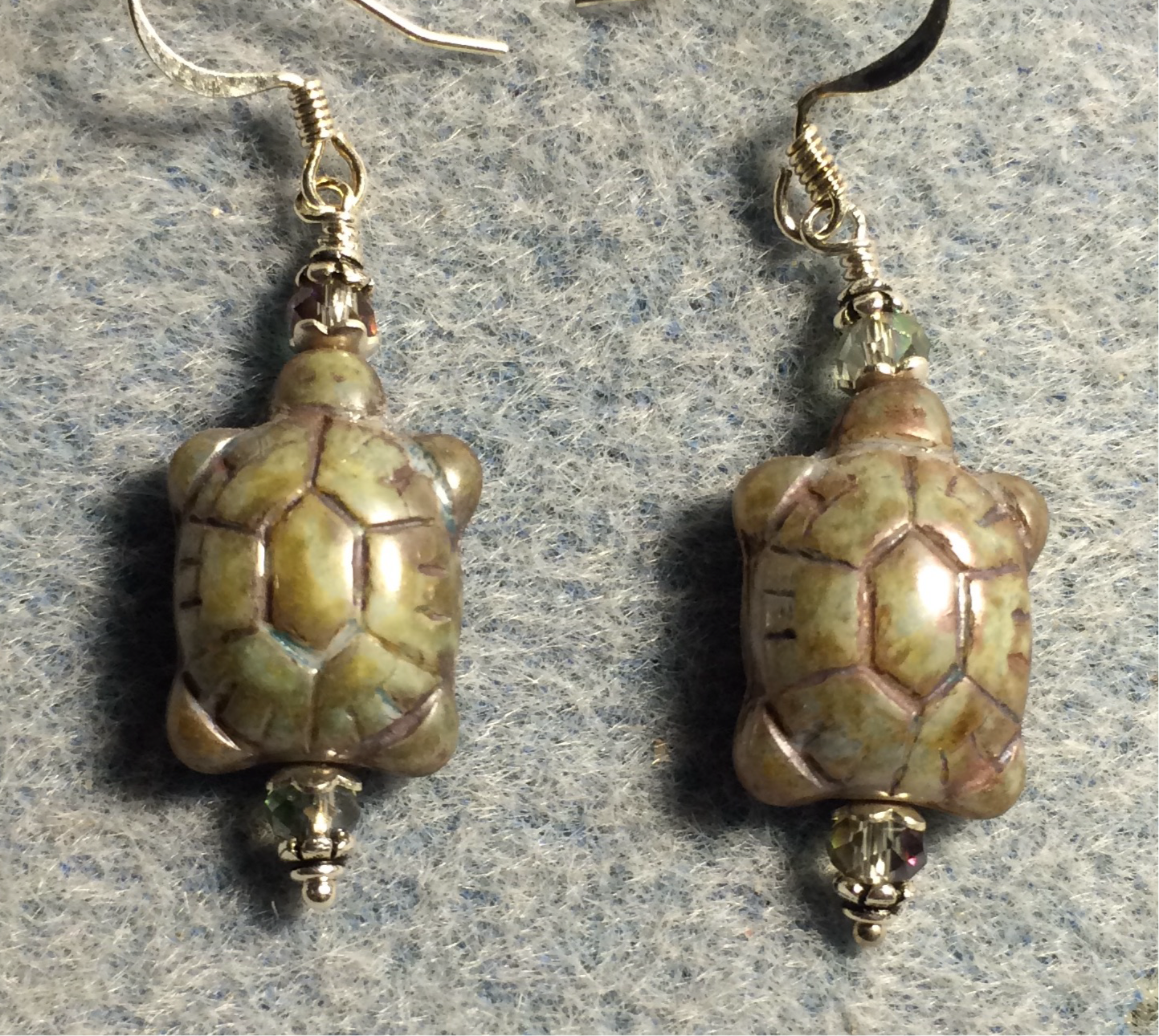 Green Picasso Czech glass turtle bead earrings adorned with sparkly green Chinese crystal beads.