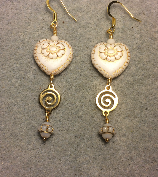 Opaque white (with gold inlay) Czech glass heart bead earrings adorned with gold swirly links and white Czech glass Saturn beads.