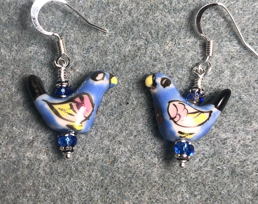 Small blue and yellow ceramic bird bead earrings adorned with blue Chinese crystal beads.