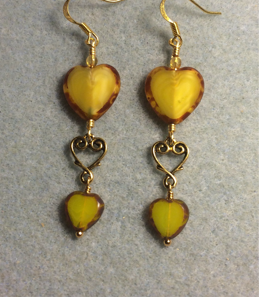 Large and small matching golden yellow Czech glass heart bead earrings joined by gold Tierracast heart connectors.