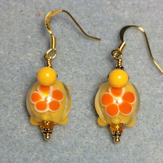 Yellow and tangerine lamp work turtle bead earrings adorned with tangerine Chinese crystal beads.