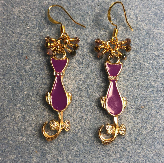 Purple and gold enamel cat charm earrings adorned with tiny dangling purple and gold Chinese crystal beads.