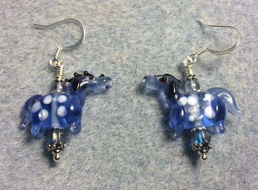 Translucent light blue lamp work spotted horse bead earrings adorned with light blue Czech glass beads.