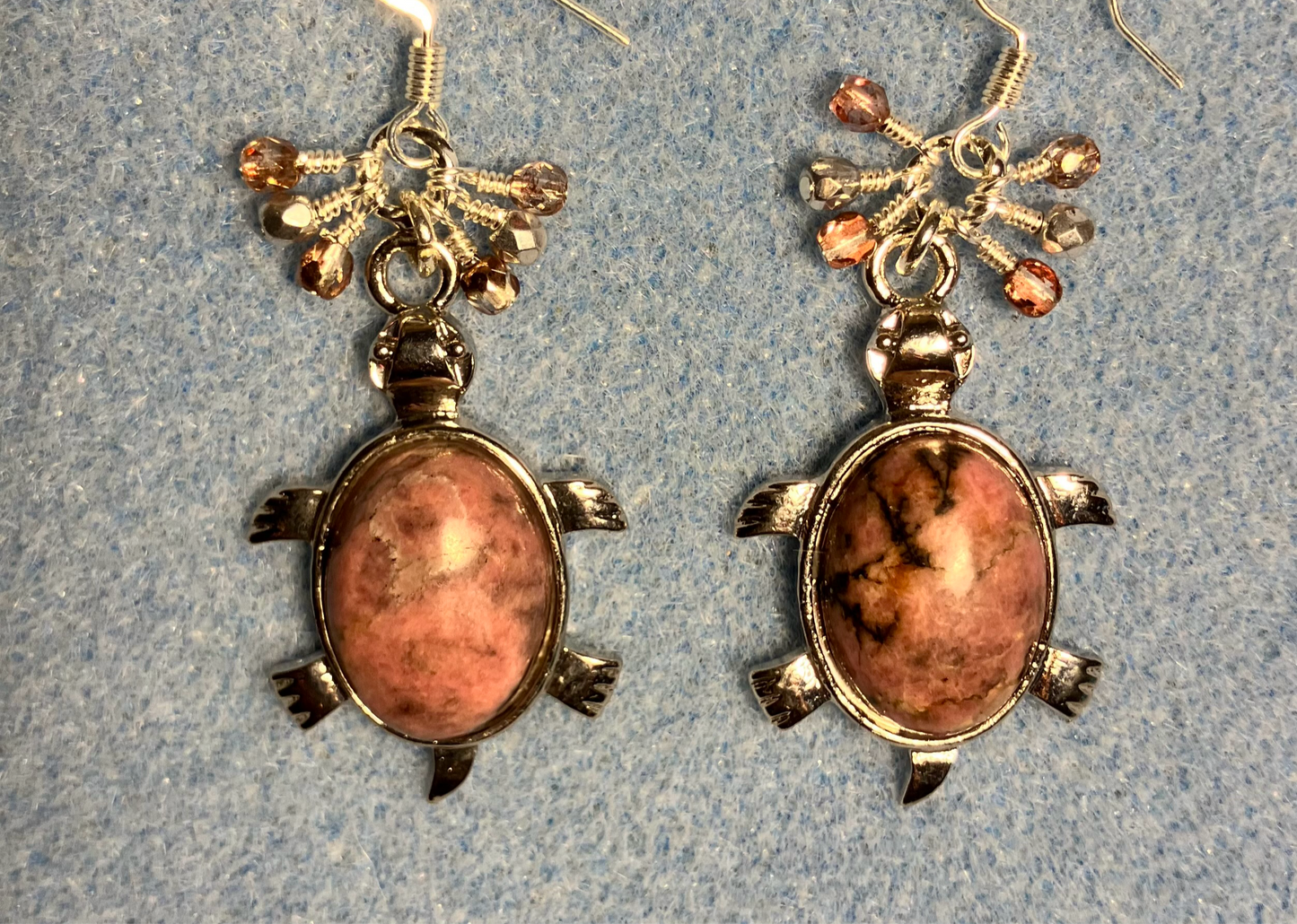 Large silver and pink rhodonite gemstone turtle charm earrings adorned with small dangling rose and silver Czech glass beads.