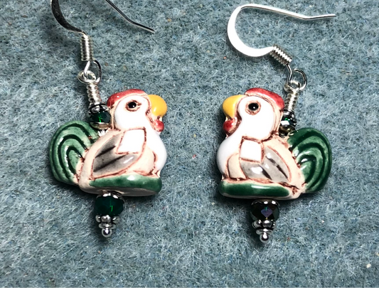 Small green, tan, yellow, and red ceramic hen bead earrings adorned with dark green Chinese crystal beads.