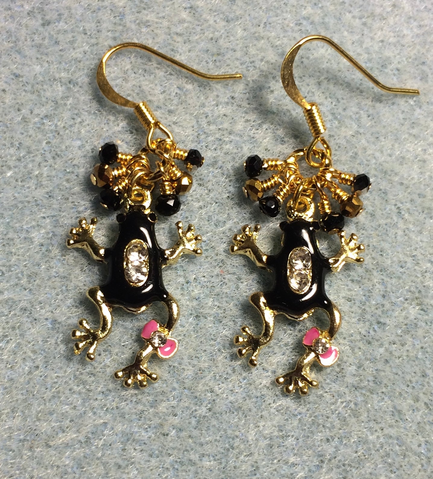 Black and pink enamel and rhinestone frog charm earrings adorned with tiny dangling black and gold Chinese crystal beads.