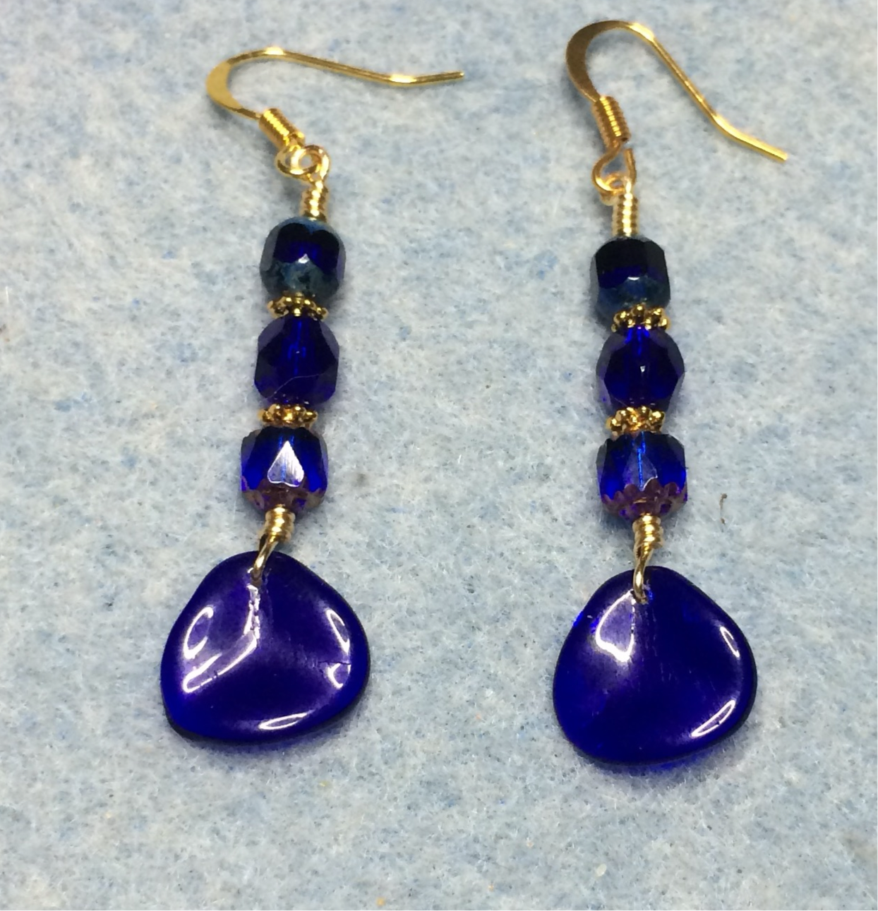 Cobalt blue Czech glass rose petal earrings adorned with cobalt blue Czech glass beads.