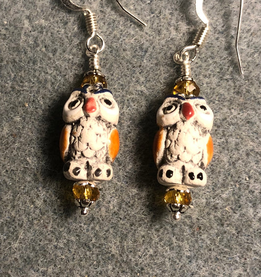 Small tan and amber ceramic owl bead earrings adorned with amber Chinese crystal beads.