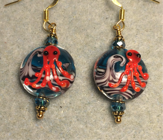 Turquoise and red lamp work octopus bead earrings adorned with turquoise Chinese crystal beads.
