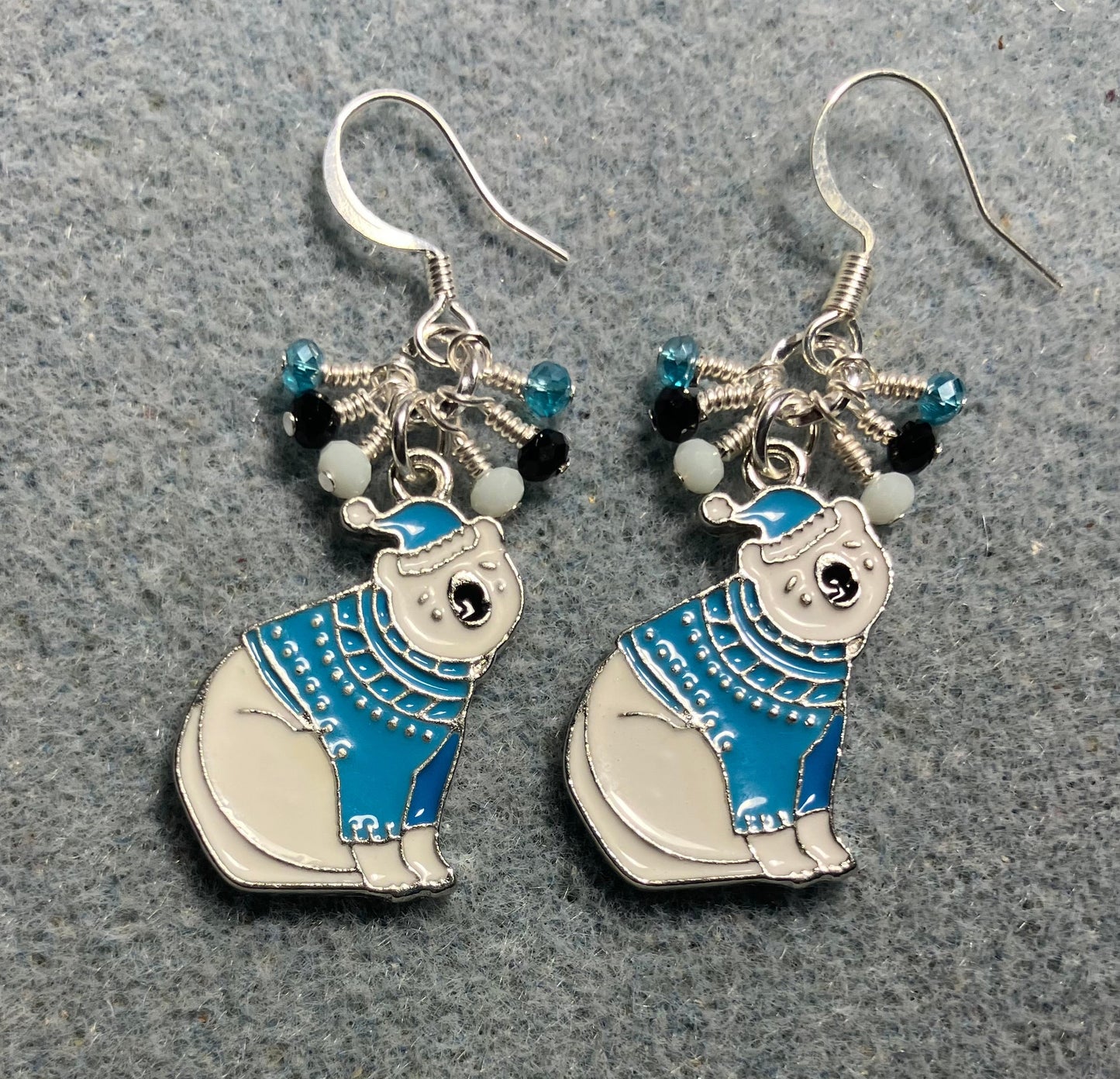 White and turquoise enamel polar bear charm earrings adorned with tiny dangling white, black, and turquoise Chinese crystal beads.