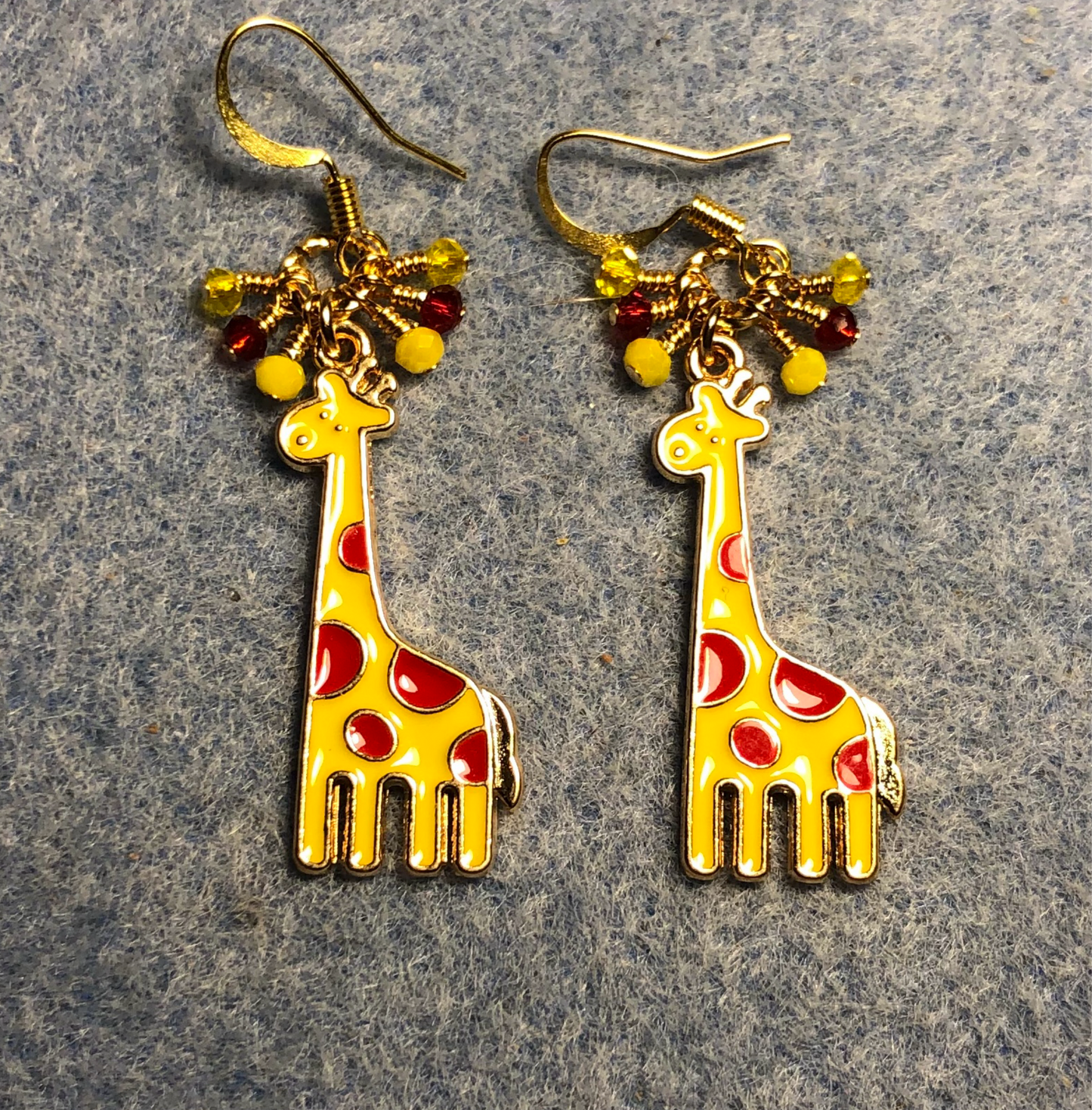 Yellow and red enamel spotted giraffe charm earrings adorned with tiny dangling yellow and red Chinese crystal beads.