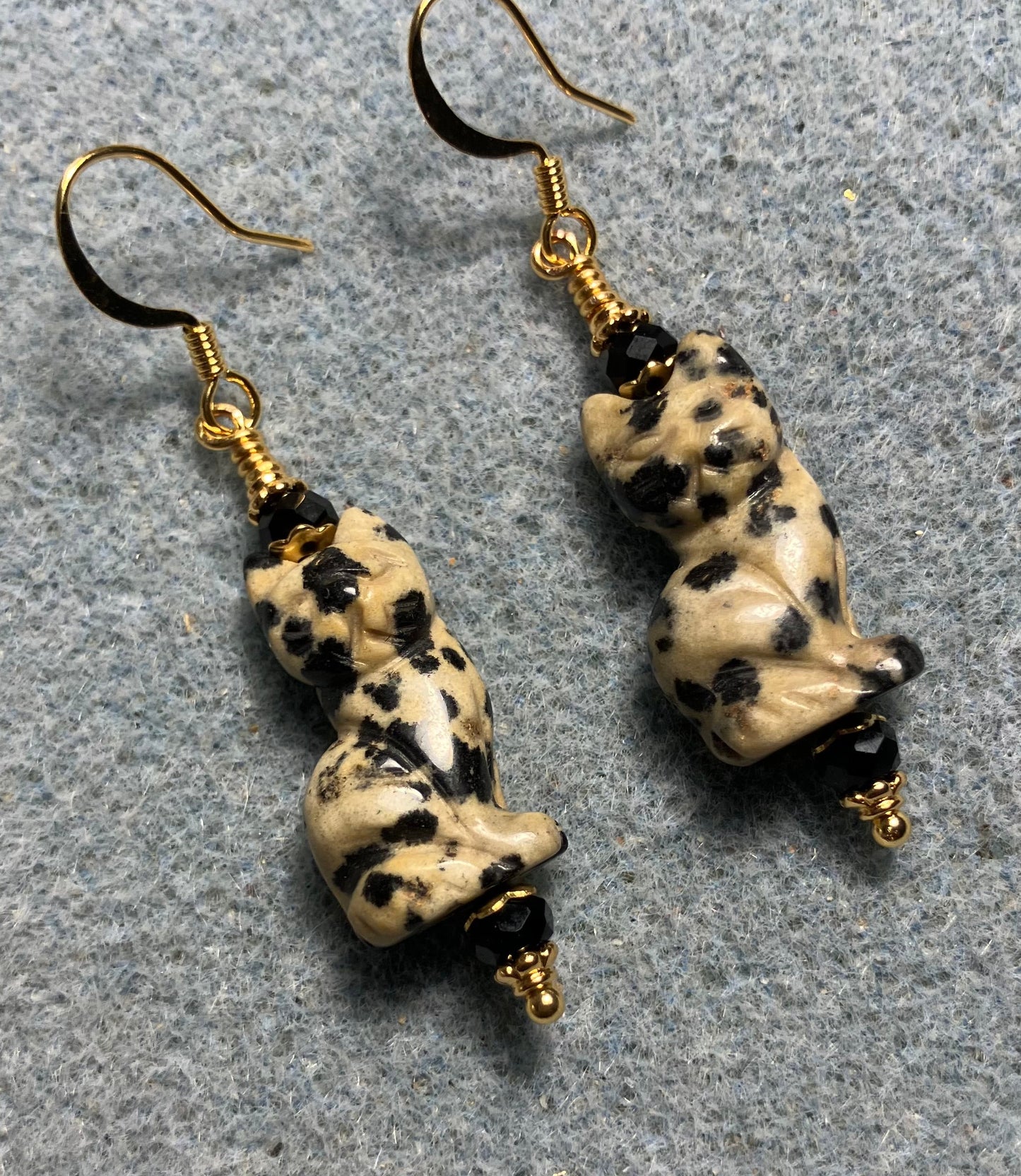 Dalmatian jasper gemstone cat bead earrings adorned with black Chinese crystal beads.