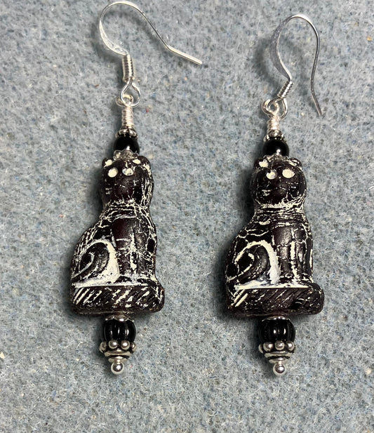 Black (with white inlay) fancy Czech glass cat bead earrings adorned with black Czech glass beads.