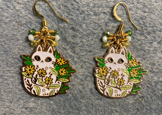 White, green, and yellow enamel cat charm earrings adorned with tiny dangling white, green, and yellow Chinese crystal beads.