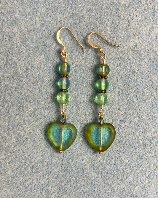 Light blue green Czech glass heart bead earrings adorned with blue green Czech glass beads.