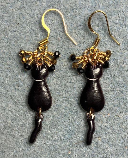 Black and gold enamel cat charm earrings adorned with tiny dangling black and gold Chinese crystal beads.