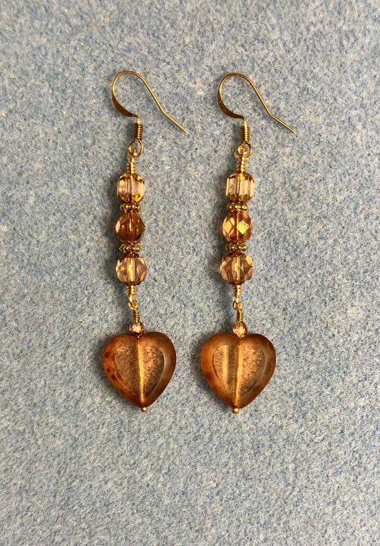 Peach Czech glass heart bead earrings adorned with peach Czech glass beads.