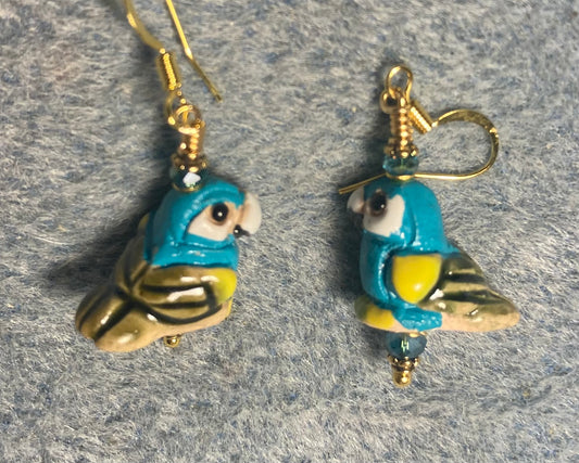 Small turquoise and yellow ceramic parrot bead earrings adorned with turquoise Chinese crystal beads.