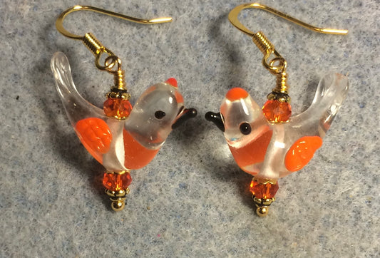 Clear and orange lamp work songbird bead earrings adorned with orange Chinese crystal beads.