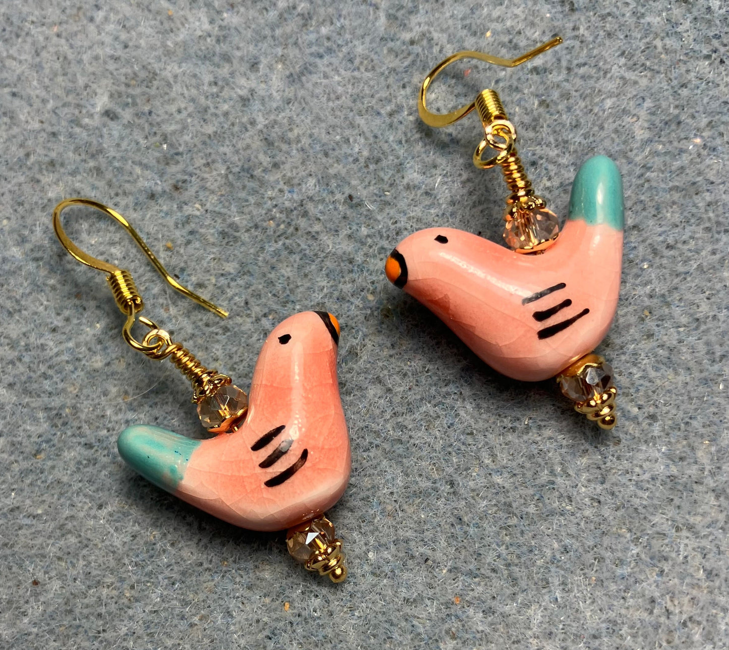 Small peach and turquoise ceramic bird bead earrings adorned with peach Chinese crystal beads.