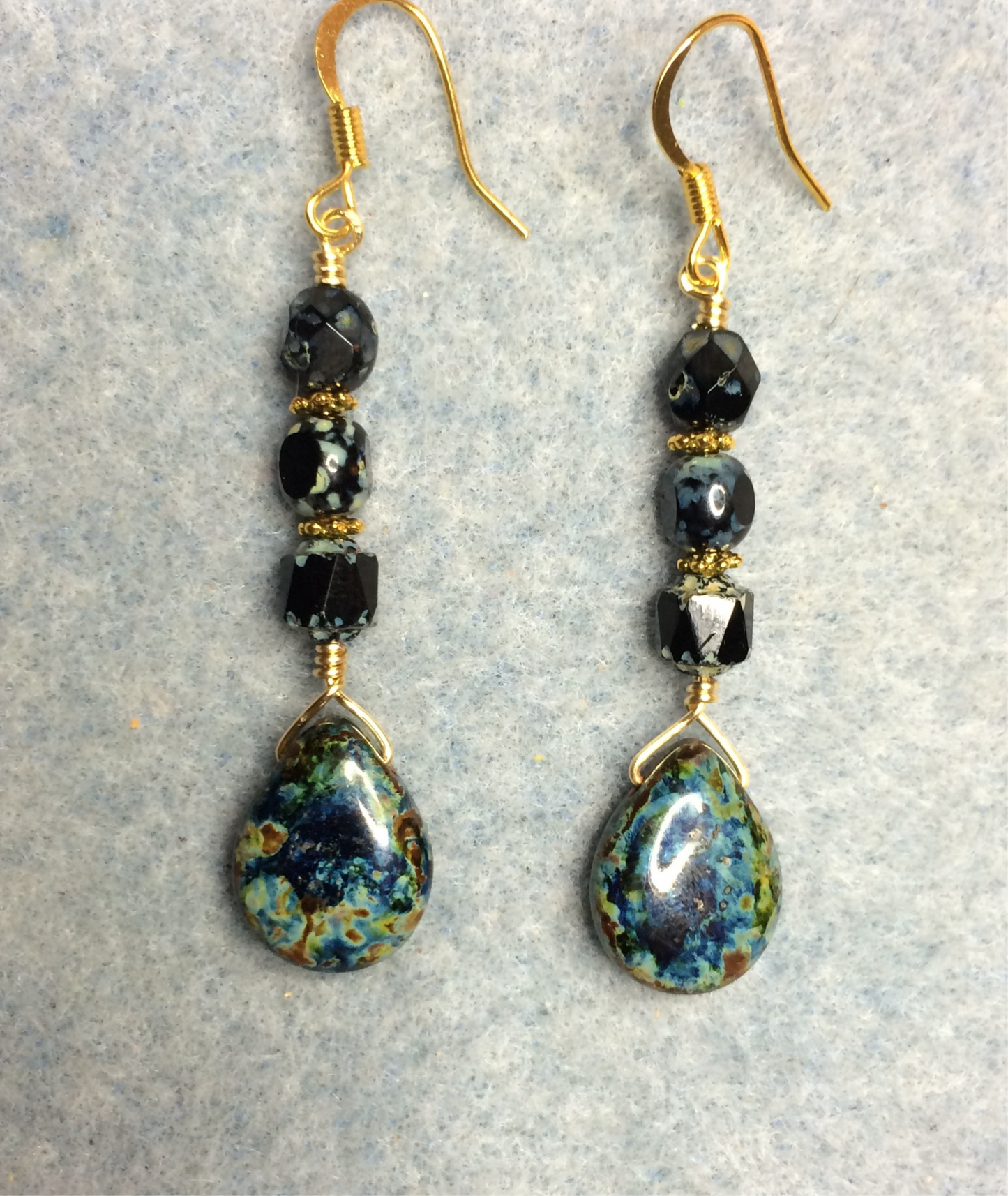 Black Picasso Czech glass pear drop bead earrings adorned with black Picasso Czech glass beads.