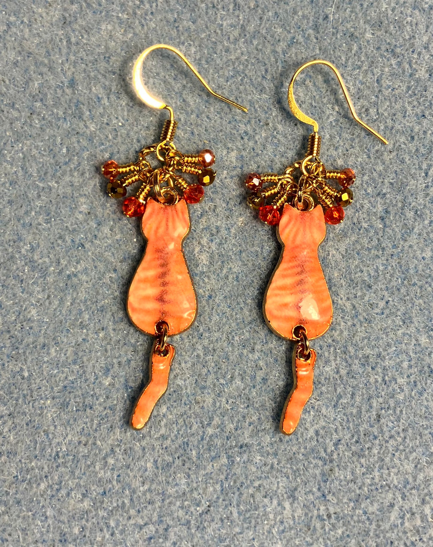 Orange and gold enamel tabby cat charm earrings adorned with tiny dangling orange and gold Chinese crystal beads.