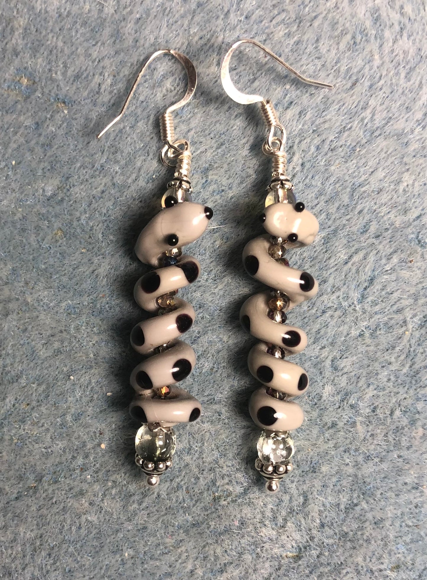 Gray and black lamp work coiled snake bead earrings adorned with clear Czech glass beads and tiny clear Chinese crystal beads.