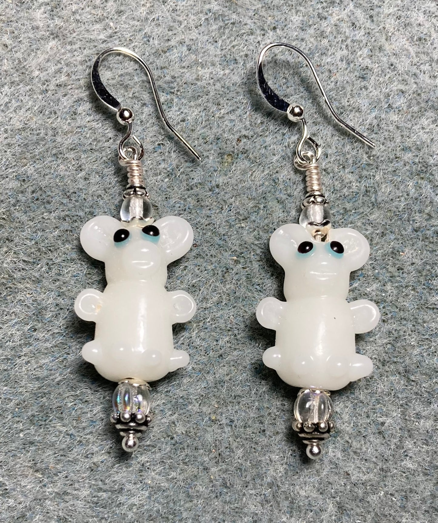 White lamp work mouse bead earrings adorned with clear Czech glass beads.