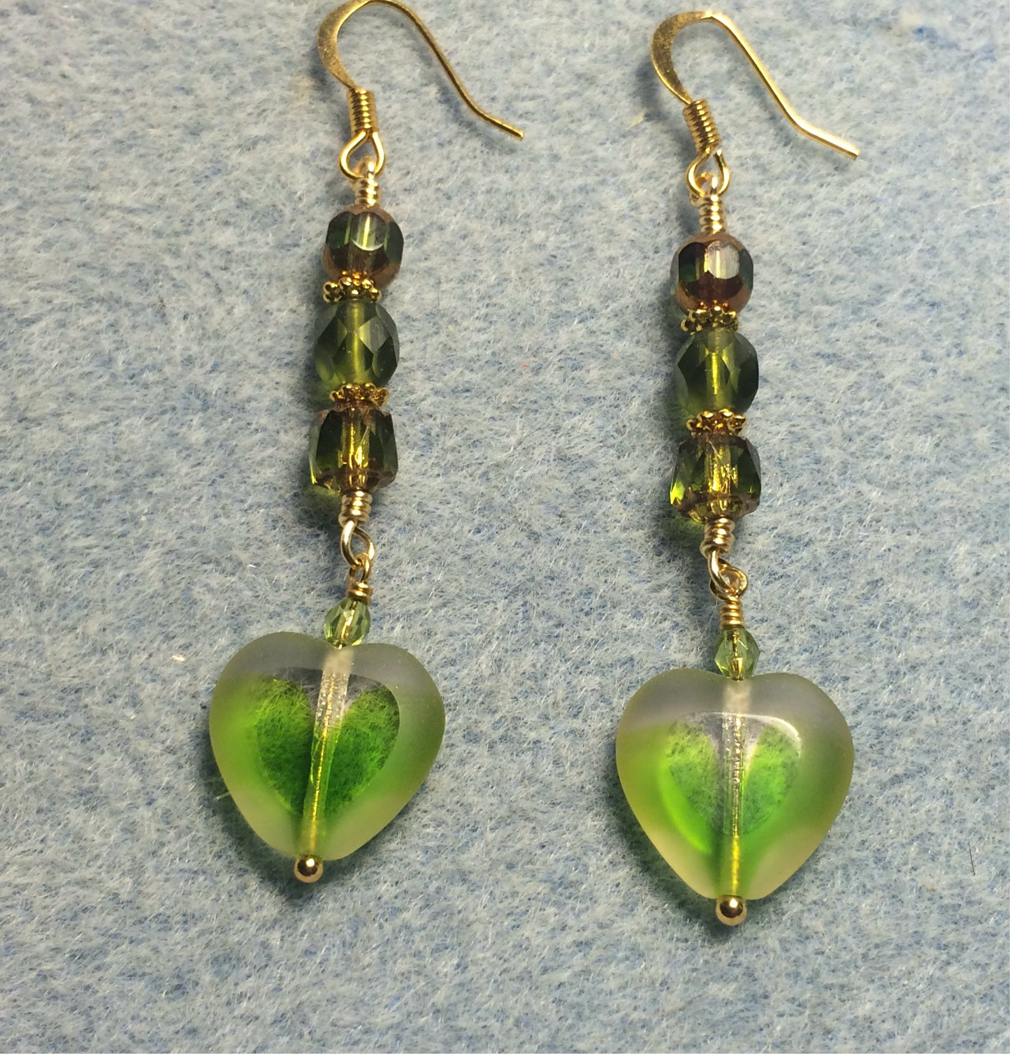 Yellow green Czech glass heart bead earrings adorned with yellow green Czech glass beads.