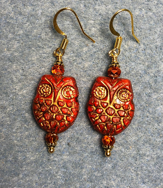 Orange (with gold wash) Czech glass owl bead earrings adorned with orange Chinese crystal beads.