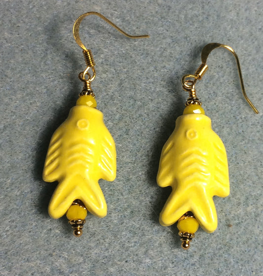 Yellow ceramic fish bead earrings adorned with yellow Chinese crystal beads.